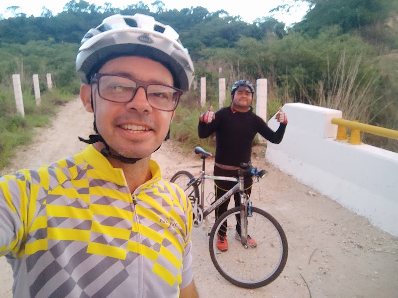 2 cyclists who make disciples by saying "Hello world! We have good news for you!"